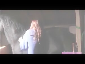 Woman in ecstasy with a horse