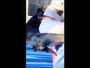 Mature woman sharing intimate moments with a dog