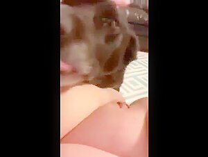Woman and her dog in an intimate relationship