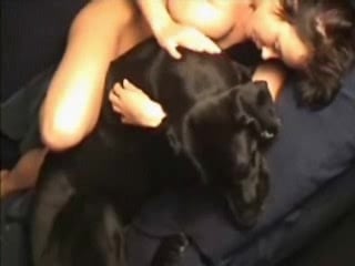 Brunette fucked by a dog